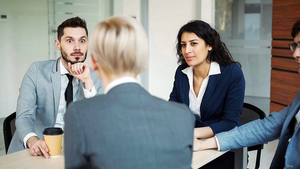 Founder presenting a product vision to investors. Photo by Vitaly Gariev on Unsplash